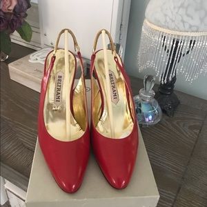 Italian designer. Red strap heel.
